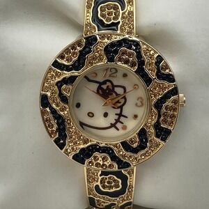 Sanrio Hello Kitty Womens Watch Gold Tone Crystals Leopard Cuff New Battery 6.5"